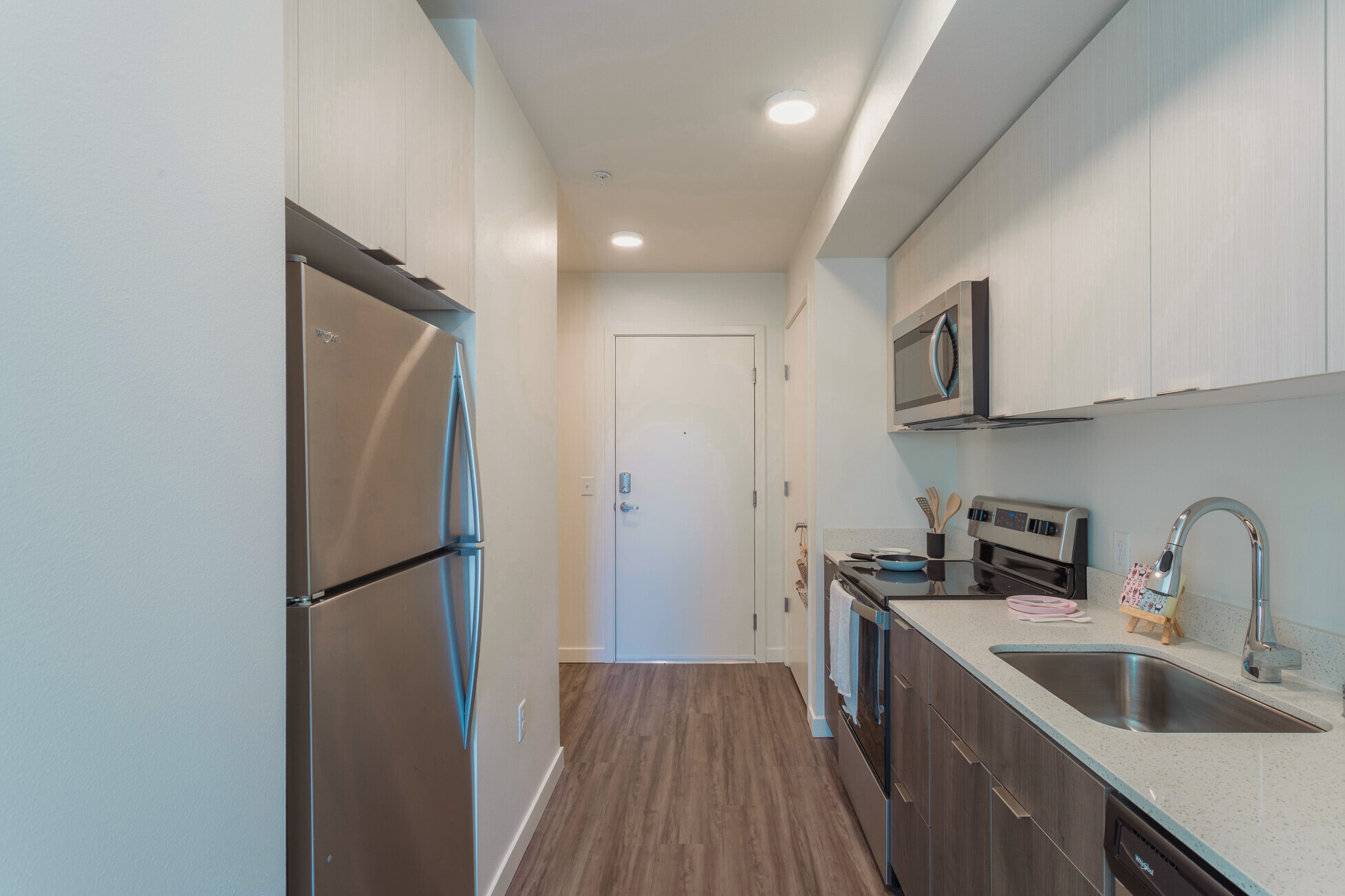 Entry hall and kitchen view inside a residence